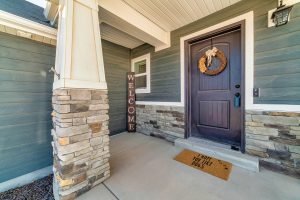 Picture of a home entryway with beautiful new siding installed.