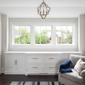 Cozy reading nook with square windows.