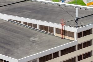 Large commercial building with flat roofing installed.